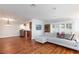 Open-concept living room with hardwood floors and a view into the kitchen and dining area at 6309 Fairbanks Rd, Las Vegas, NV 89103