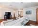 Open-concept living room with hardwood floors and view to kitchen and dining room at 6309 Fairbanks Rd, Las Vegas, NV 89103