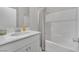 Bright bathroom with a white shower, tub, and vanity offering a clean and modern aesthetic at 6945 Trevelez St, Las Vegas, NV 89149