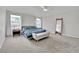 Bright and spacious bedroom with a ceiling fan and large windows, creating a cozy retreat at 6945 Trevelez St, Las Vegas, NV 89149