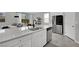 Bright kitchen with island and stainless steel appliances in an open concept floor plan at 6945 Trevelez St, Las Vegas, NV 89149