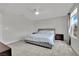 Neutral main bedroom with a queen size bed, carpet, and a window for natural light at 6945 Trevelez St, Las Vegas, NV 89149