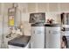 Water heater, water softener, and water filter in the garage or utility room at 6945 Trevelez St, Las Vegas, NV 89149