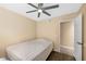 Bedroom with hardwood floors, ceiling fan, standard closet, and door to another room at 7026 Westpark Ct, Las Vegas, NV 89147