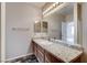 Bathroom with a granite countertop vanity, mirror, and tile flooring at 7119 S Durango Dr # 312, Las Vegas, NV 89113