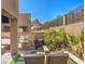 Serene backyard space with a built-in grill, cozy seating, and lush greenery, perfect for outdoor enjoyment at 72 Reverie Heights Ave, Henderson, NV 89011