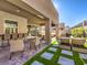 Relaxing backyard oasis with a covered patio, water feature, and outdoor kitchen perfect for entertaining at 72 Reverie Heights Ave, Henderson, NV 89011