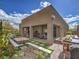 Backyard with a covered patio, grill area, and decorative elements, perfect for entertaining outdoors at 72 Reverie Heights Ave, Henderson, NV 89011