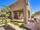 Outdoor living space with a covered patio, grill station, and manicured greenery, ideal for entertaining at 72 Reverie Heights Ave, Henderson, NV 89011