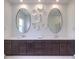 Contemporary bathroom with dual sinks, decorative wall pieces, and ample counter space at 72 Reverie Heights Ave, Henderson, NV 89011