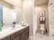 Well-lit bathroom featuring a modern vanity and shower with stylish finishes at 72 Reverie Heights Ave, Henderson, NV 89011