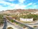 Community entrance sign for Lake Las Vegas with surrounding palm trees and mountain views at 72 Reverie Heights Ave, Henderson, NV 89011