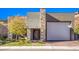 Modern home showcasing stone accents, a double door entry, and desert-friendly landscaping at 72 Reverie Heights Ave, Henderson, NV 89011