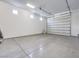 Spacious garage with an epoxy floor and an automatic garage door at 72 Reverie Heights Ave, Henderson, NV 89011