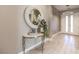 Entryway featuring an accent table, stylish mirror, and modern lighting, creating a welcoming ambiance at 72 Reverie Heights Ave, Henderson, NV 89011