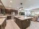 Modern kitchen featuring a large island with a marble countertop and stainless steel appliances at 72 Reverie Heights Ave, Henderson, NV 89011