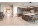 Bright, open kitchen with a large island, stainless appliances, and modern tile flooring at 72 Reverie Heights Ave, Henderson, NV 89011