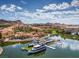 Aerial view of Lake Las Vegas with colorful buildings, boats, and stunning mountain views in the background at 72 Reverie Heights Ave, Henderson, NV 89011