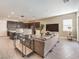 Open-concept living space with modern decor, seamlessly connecting to the kitchen at 72 Reverie Heights Ave, Henderson, NV 89011