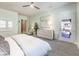 Spacious main bedroom with light green walls, neutral decor, and outdoor access at 72 Reverie Heights Ave, Henderson, NV 89011