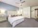 Airy main bedroom with cool-toned walls, a plush bed, and stylish furnishings at 72 Reverie Heights Ave, Henderson, NV 89011