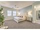 Serene main bedroom featuring neutral walls, carpet, and plenty of natural light at 72 Reverie Heights Ave, Henderson, NV 89011