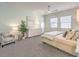 Comfortable main bedroom featuring a ceiling fan, windows, and calming decor at 72 Reverie Heights Ave, Henderson, NV 89011