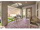 Covered patio with seating, a hot tub, and views of the landscaped backyard at 72 Reverie Heights Ave, Henderson, NV 89011