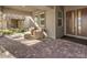 Inviting front porch with brick pavers and comfortable outdoor seating area by the entry door at 72 Reverie Heights Ave, Henderson, NV 89011