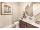 Stylish powder room with textured wallpaper, vanity, and decorative mirror at 72 Reverie Heights Ave, Henderson, NV 89011