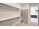 Spacious walk-in closet with ample shelving and rods for organized storage at 72 Reverie Heights Ave, Henderson, NV 89011