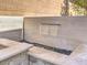 Beautiful water feature with smooth stones for peaceful outdoor living at 72 Reverie Heights Ave, Henderson, NV 89011