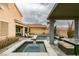 Beautiful backyard with pool, spa, and covered seating area, perfect for outdoor entertaining and relaxation at 748 Fast Green Way, Las Vegas, NV 89148