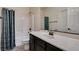 Clean bathroom featuring a shower-tub combo and spacious vanity with a white countertop at 748 Fast Green Way, Las Vegas, NV 89148