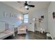 Charming Bedroom with a crib, plush chair, and whimsical decorations at 748 Fast Green Way, Las Vegas, NV 89148