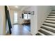 Inviting home foyer with tile flooring, staircase, and a modern mirror accent at 748 Fast Green Way, Las Vegas, NV 89148