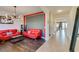 Bright living room featuring wood floors, an eye-catching light fixture, and modern decor at 748 Fast Green Way, Las Vegas, NV 89148