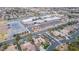 Aerial view of a home with a pool and a school in the background in a suburban neighborhood at 7816 Sandy Eagle Ct, Las Vegas, NV 89129