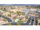 Gorgeous aerial shot of a desert home showcasing a landscaped front yard with palm trees, and a school nearby at 7816 Sandy Eagle Ct, Las Vegas, NV 89129