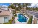 A serene backyard with a beautiful pool, lush landscaping, and privacy, perfect for relaxation at 7816 Sandy Eagle Ct, Las Vegas, NV 89129