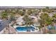 A serene backyard with a beautiful pool, lush landscaping, and a row of palm trees for privacy at 7816 Sandy Eagle Ct, Las Vegas, NV 89129