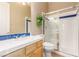 This bathroom has a tile shower and a blue tile counter at 7816 Sandy Eagle Ct, Las Vegas, NV 89129