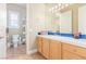 This bathroom has a blue tile countertop and tile flooring at 7816 Sandy Eagle Ct, Las Vegas, NV 89129