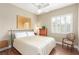 Bedroom featuring ceiling fan, shutters and neutral paint at 7816 Sandy Eagle Ct, Las Vegas, NV 89129