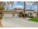 Inviting single-story home with a three car garage, well-maintained landscaping, and long driveway at 7816 Sandy Eagle Ct, Las Vegas, NV 89129