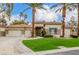 Charming single-story home with a three car garage, desert landscaping, and large paved driveway at 7816 Sandy Eagle Ct, Las Vegas, NV 89129