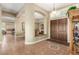 Grand foyer features tile flooring, arched doorways, and views of the living spaces at 7816 Sandy Eagle Ct, Las Vegas, NV 89129