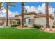 Attractive single-story home with a three-car garage, tidy landscaping, and artificial turf at 7816 Sandy Eagle Ct, Las Vegas, NV 89129