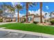Well-maintained single-story home with manicured landscaping, three-car garage, and paved driveway at 7816 Sandy Eagle Ct, Las Vegas, NV 89129