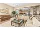 Open-concept living area with eat-in kitchen, comfortable seating, and bright natural light at 7816 Sandy Eagle Ct, Las Vegas, NV 89129